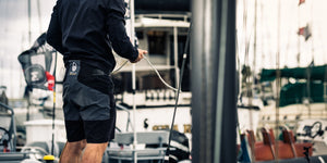 Sailor wearing technical sailing shorts on board